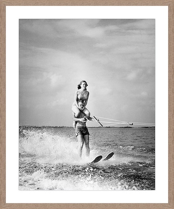 30 x 36 Young man Waterskiing in sea with young woman sitting on his shoulders (GF)